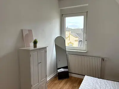 Ein Bett oder Betten in einem Zimmer der Unterkunft Moderne Unterkunft mit Komfort & Top-Lage