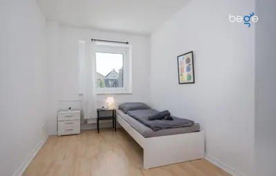 Ein Bett oder Betten in einem Zimmer der Unterkunft BEGE APARTMENTS ProStay