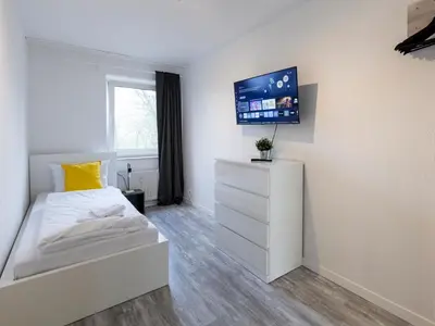 TV/Unterhaltungsangebot in der Unterkunft BudgetRoom Modernes Apartment mit 3 Schlafzimmern