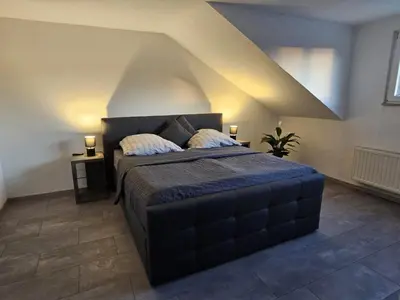 Ein Bett oder Betten in einem Zimmer der Unterkunft Ferienwohnung Hagen Hohenlimburg