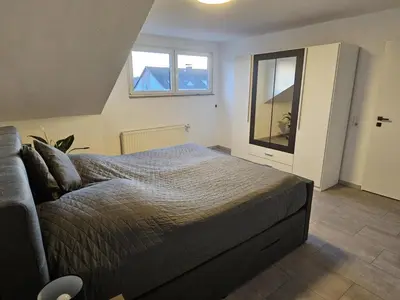 Ein Bett oder Betten in einem Zimmer der Unterkunft Ferienwohnung Hagen Hohenlimburg