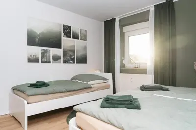 Ein Bett oder Betten in einem Zimmer der Unterkunft DAS GRÜNE NEST Münsterland Living