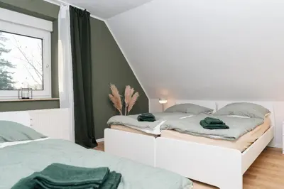 Ein Bett oder Betten in einem Zimmer der Unterkunft DAS GRÜNE NEST Münsterland Living