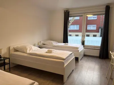 Ein Bett oder Betten in einem Zimmer der Unterkunft T&K Apartments - Herne - 2 Zimmer Wohnungen - Vollausgestattet