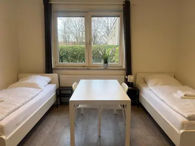 Ein Bett oder Betten in einem Zimmer der Unterkunft T&K Apartments - Herne - 2 Zimmer Wohnungen - Vollausgestattet