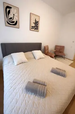 Ein Bett oder Betten in einem Zimmer der Unterkunft Helios City Room