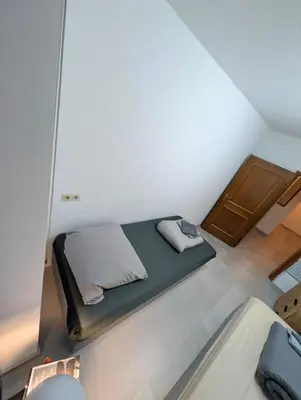 Ein Bett oder Betten in einem Zimmer der Unterkunft Johanna City Apartment - 150 m2 - 13 Guests