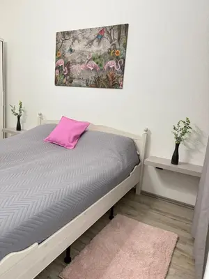 Ein Bett oder Betten in einem Zimmer der Unterkunft Time Wohnung