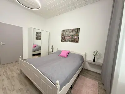 Ein Bett oder Betten in einem Zimmer der Unterkunft Time Wohnung