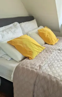 Ein Bett oder Betten in einem Zimmer der Unterkunft Cozy and fully equipped flat in the centrum