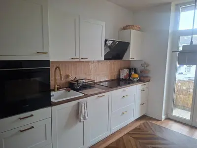 Küche/Küchenzeile in der Unterkunft Stilvolle, moderne Wohnung mit Balkon und Kamin nahe Düsseldorf&Köln