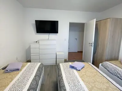 Ein Bett oder Betten in einem Zimmer der Unterkunft Voll ausgestattetes Apartment in Marl