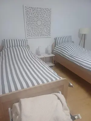 Ein Bett oder Betten in einem Zimmer der Unterkunft Gästewohnung Illa