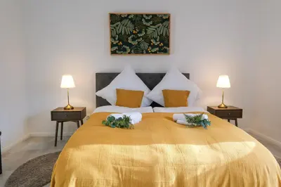 Ein Bett oder Betten in einem Zimmer der Unterkunft Deluxe House mit Terrasse & Garten - Komfort & Raum