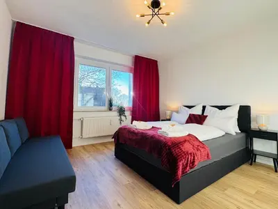 Ein Bett oder Betten in einem Zimmer der Unterkunft Charmantes Apartment mit Balkon - Küche - SmartTV