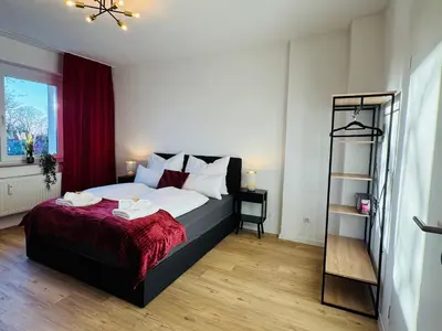 Ein Bett oder Betten in einem Zimmer der Unterkunft Charmantes Apartment mit Balkon - Küche - SmartTV