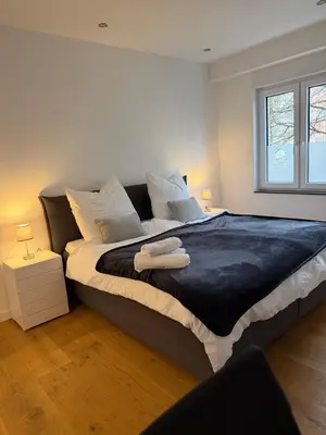 Ein Bett oder Betten in einem Zimmer der Unterkunft Auszeit am Heidter Berg City und Natur nah mit Stellplatz und Sauna