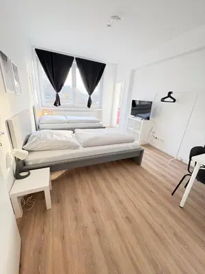 Ein Bett oder Betten in einem Zimmer der Unterkunft Workerslodge - Wohnung für 6 Personen in Ratingen - nähe Düsseldorf