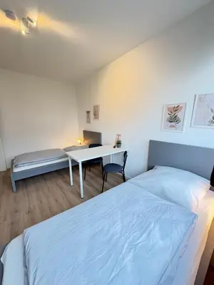 Ein Bett oder Betten in einem Zimmer der Unterkunft Workerslodge - Wohnung für 6 Personen in Ratingen - nähe Düsseldorf