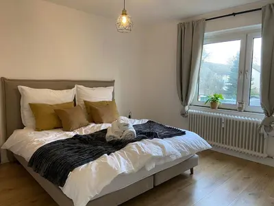 Ein Bett oder Betten in einem Zimmer der Unterkunft Große Wohnung mit perfekter Anbindung