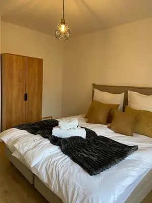 Ein Bett oder Betten in einem Zimmer der Unterkunft Große Wohnung mit perfekter Anbindung