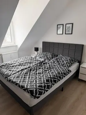 Ein Bett oder Betten in einem Zimmer der Unterkunft Gemütliche Wohnung über den Dächern von Gevelsberg
