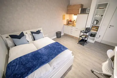 Ein Bett oder Betten in einem Zimmer der Unterkunft FÜR 2, Küche, Kaffeemaschine, Smart TV