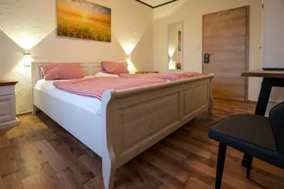Ein Bett oder Betten in einem Zimmer der Unterkunft Landhotel-Restaurant Beckmann