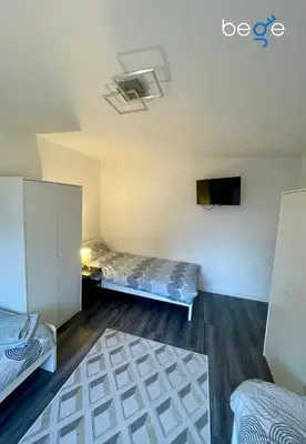 Ein Bett oder Betten in einem Zimmer der Unterkunft BEGE APARTMENTS ClearDesk