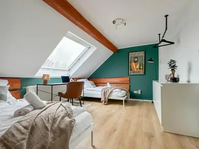 Ein Bett oder Betten in einem Zimmer der Unterkunft Modernes 2-Schlafzimmer City Apartment mit Arbeitsplatz