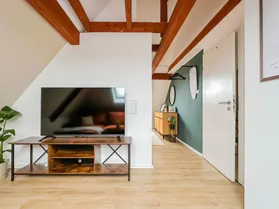 TV/Unterhaltungsangebot in der Unterkunft Modernes 2-Schlafzimmer City Apartment mit Arbeitsplatz