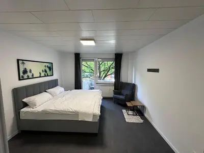 Ein Bett oder Betten in einem Zimmer der Unterkunft Große Unterkunft in Dortmund City