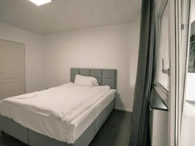 Ein Bett oder Betten in einem Zimmer der Unterkunft Große Unterkunft in Dortmund City