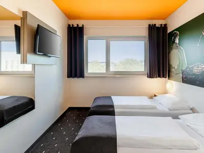 Ein Bett oder Betten in einem Zimmer der Unterkunft B&B Hotel Duisburg Hbf-Süd