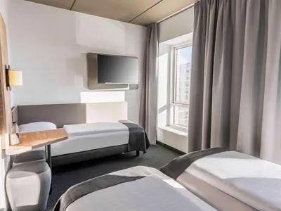 Ein Bett oder Betten in einem Zimmer der Unterkunft B&B Hotel Duisburg Hbf-Süd