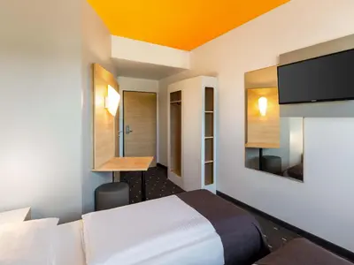 Ein Bett oder Betten in einem Zimmer der Unterkunft B&B Hotel Duisburg Hbf-Süd