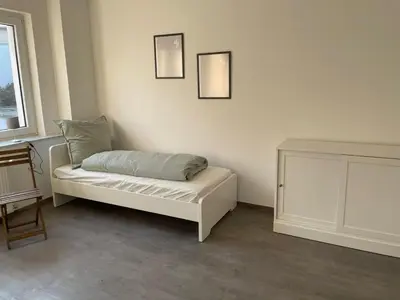 Ein Bett oder Betten in einem Zimmer der Unterkunft Einzelzimmer im Monteurhaus Gemeinschaftsbad und Küche