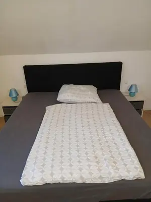 Ein Bett oder Betten in einem Zimmer der Unterkunft Blue sky apartment