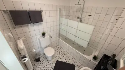 Ein Badezimmer in der Unterkunft GNA02 - Zeitgemäße Apartments mit modernen Küchen, Balkon & Parkplatz
