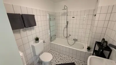 Ein Badezimmer in der Unterkunft GNA02 - Zeitgemäße Apartments mit modernen Küchen, Balkon & Parkplatz