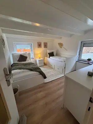 Ein Bett oder Betten in einem Zimmer der Unterkunft 115 qm Apartment für bis zu 8 Personen mit 4 Schlafzimmern
