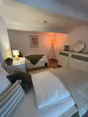 Ein Bett oder Betten in einem Zimmer der Unterkunft 115 qm Apartment für bis zu 8 Personen mit 4 Schlafzimmern