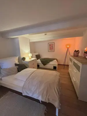Ein Bett oder Betten in einem Zimmer der Unterkunft 115 qm Apartment für bis zu 8 Personen mit 4 Schlafzimmern