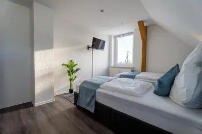 Ein Bett oder Betten in einem Zimmer der Unterkunft Moderne Doppelhaushälfte mit Garten & Terrasse I Free Wifi I Free Parking