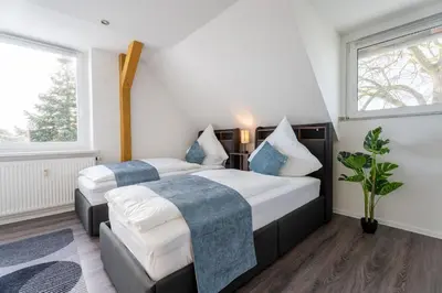 Ein Bett oder Betten in einem Zimmer der Unterkunft Moderne Doppelhaushälfte mit Garten & Terrasse I Free Wifi I Free Parking