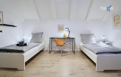 Ein Bett oder Betten in einem Zimmer der Unterkunft BEGE APARTMENTS DeskSide