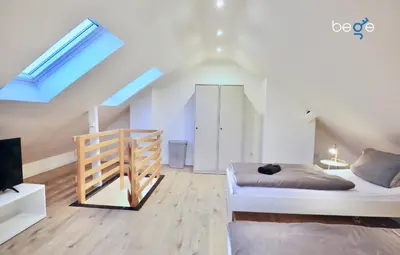 Ein Bett oder Betten in einem Zimmer der Unterkunft BEGE APARTMENTS DeskSide