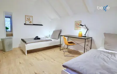 Ein Bett oder Betten in einem Zimmer der Unterkunft BEGE APARTMENTS DeskSide