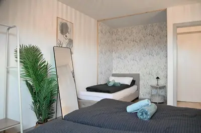 Ein Bett oder Betten in einem Zimmer der Unterkunft JuPa Homes gemütliches DG Apartment