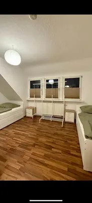 Ein Bett oder Betten in einem Zimmer der Unterkunft Dachnest Gemütliche Wohnung im Herzen Düsseldorf